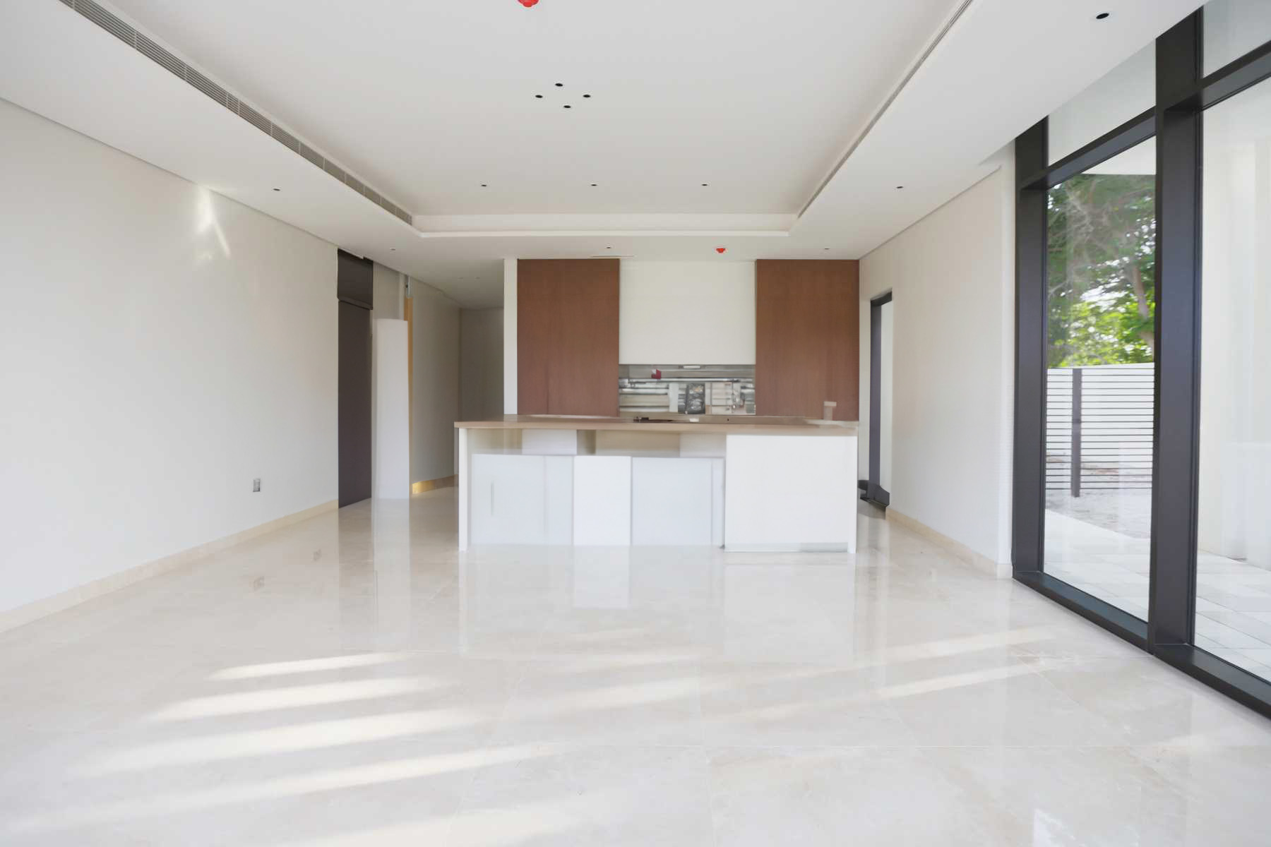 Bright interiors with floor-to-ceiling windows at Jawaher Saadiyat villas Saadiyat Island Abu Dhabi