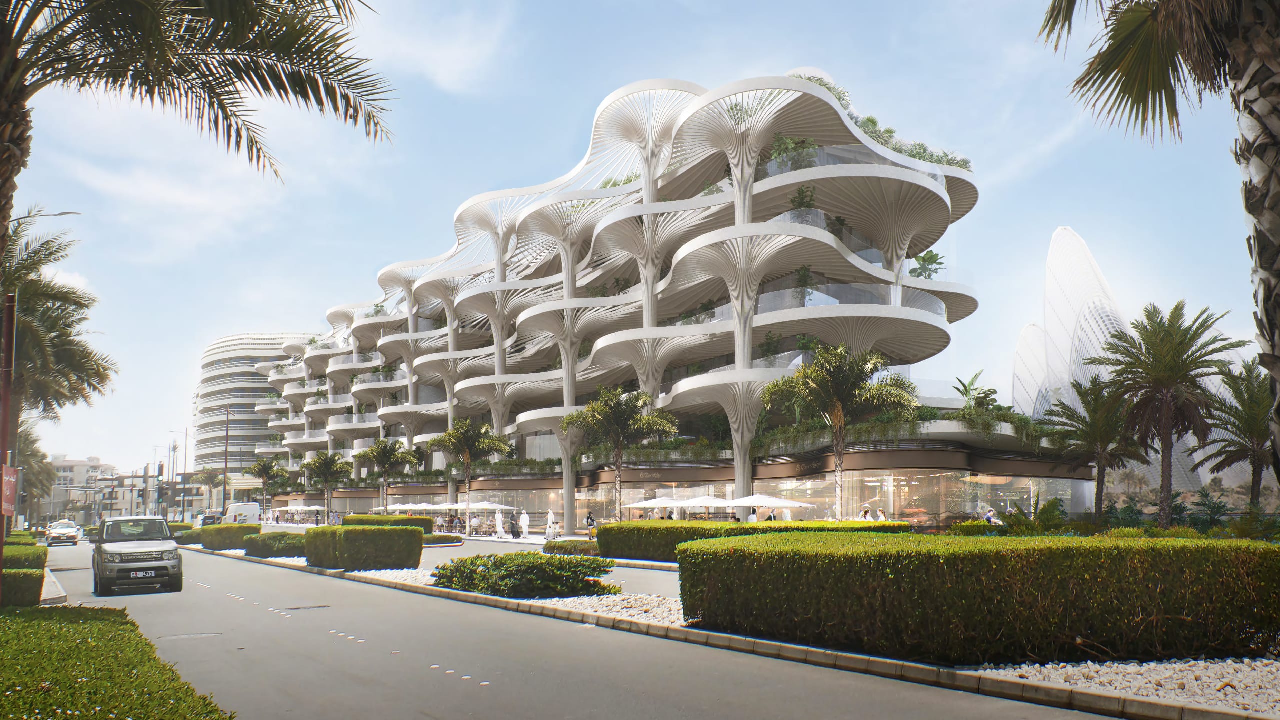 Aerial exterior view of Mamsha Palm residences overlooking Saadiyat beach and clear blue waters