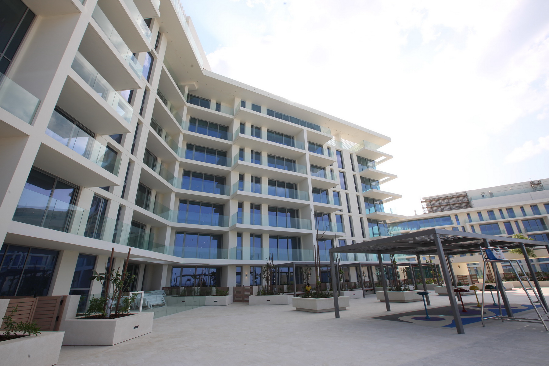 Architectural close-up showing sleek lines, contemporary materials, and textured façade elements