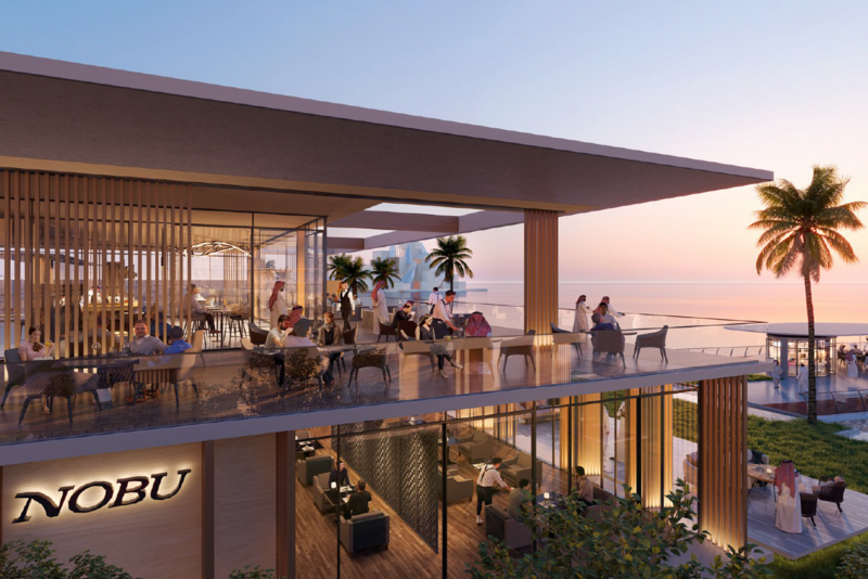 Daytime exterior view of Nobu Residences by Aldar Properties in Abu Dhabi, showing beachfront luxury architecture and landscaped surroundings.