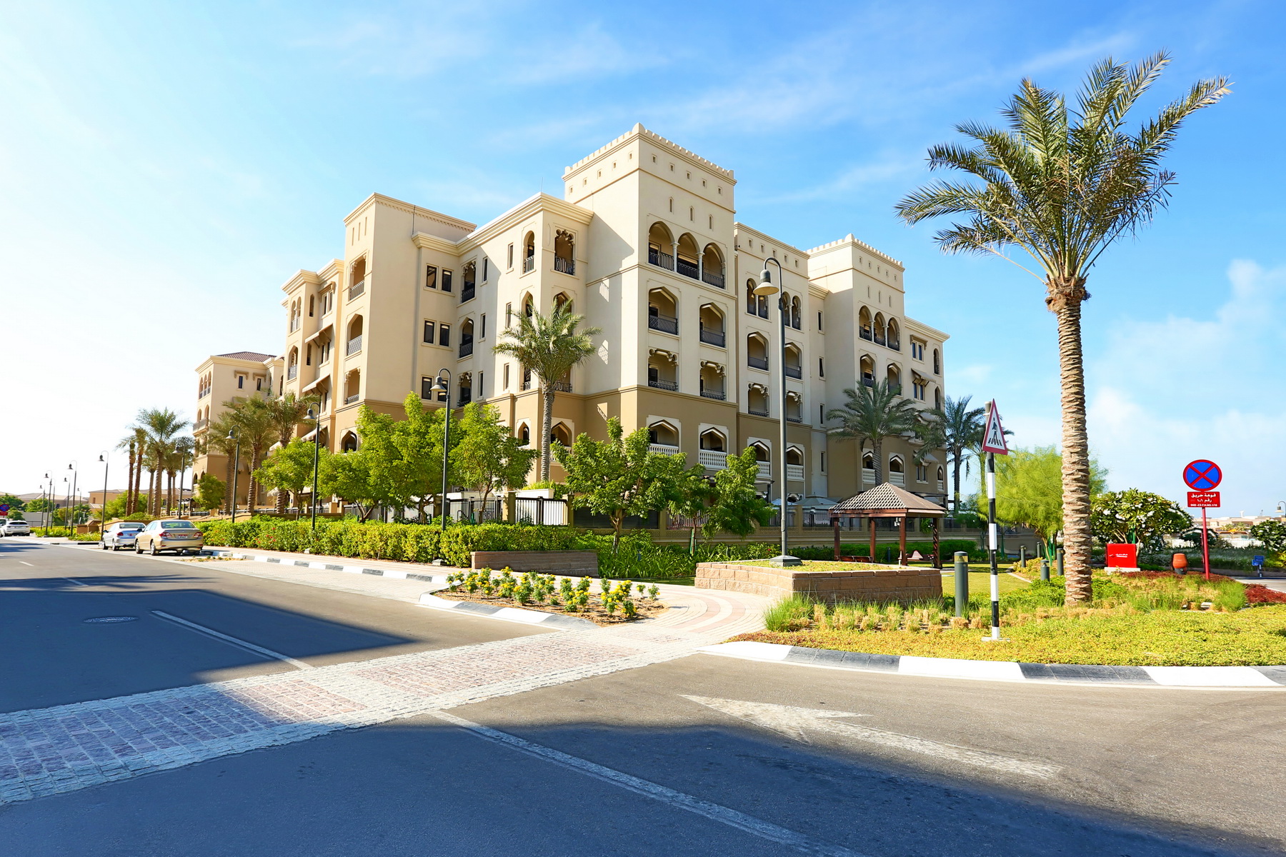 Exterior view of Saadiyat Beach Residences showcasing Mediterranean‑style architecture and landscaped surroundings.