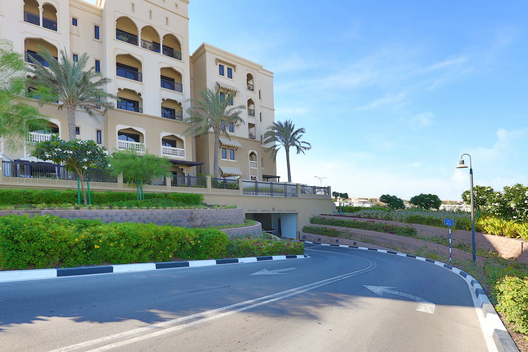 Facade of Saadiyat Beach Residences with low‑rise buildings and elegant Mediterranean design.