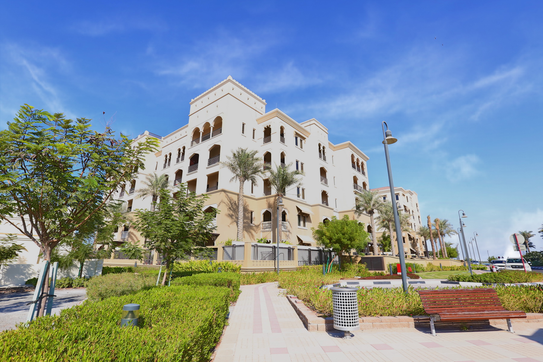 Architectural exterior of Saadiyat Beach Residences highlighting its premium Mediterranean aesthetic.